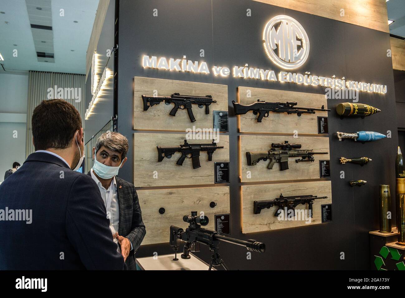 Assault rifles are displayed at the exhibition booth of the Mechanical