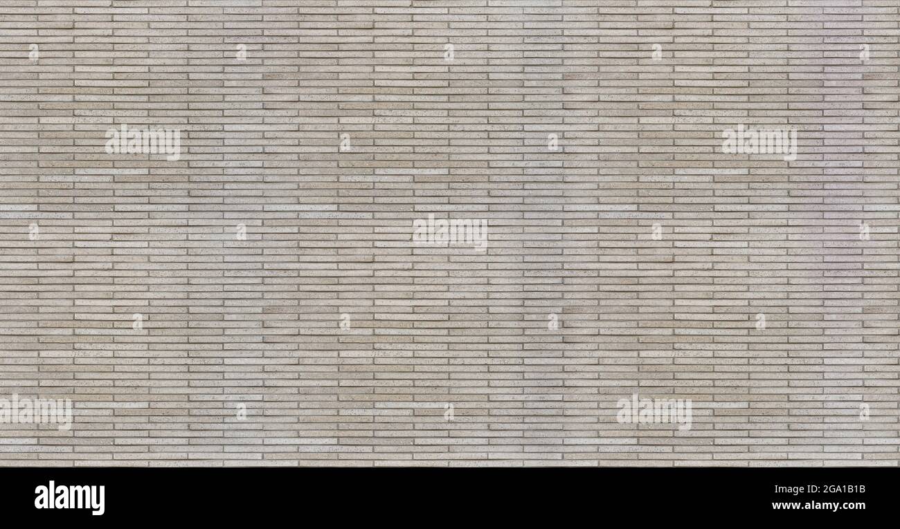 Wall made of thin artificial stone bricks, seamless texture pattern Stock Photo