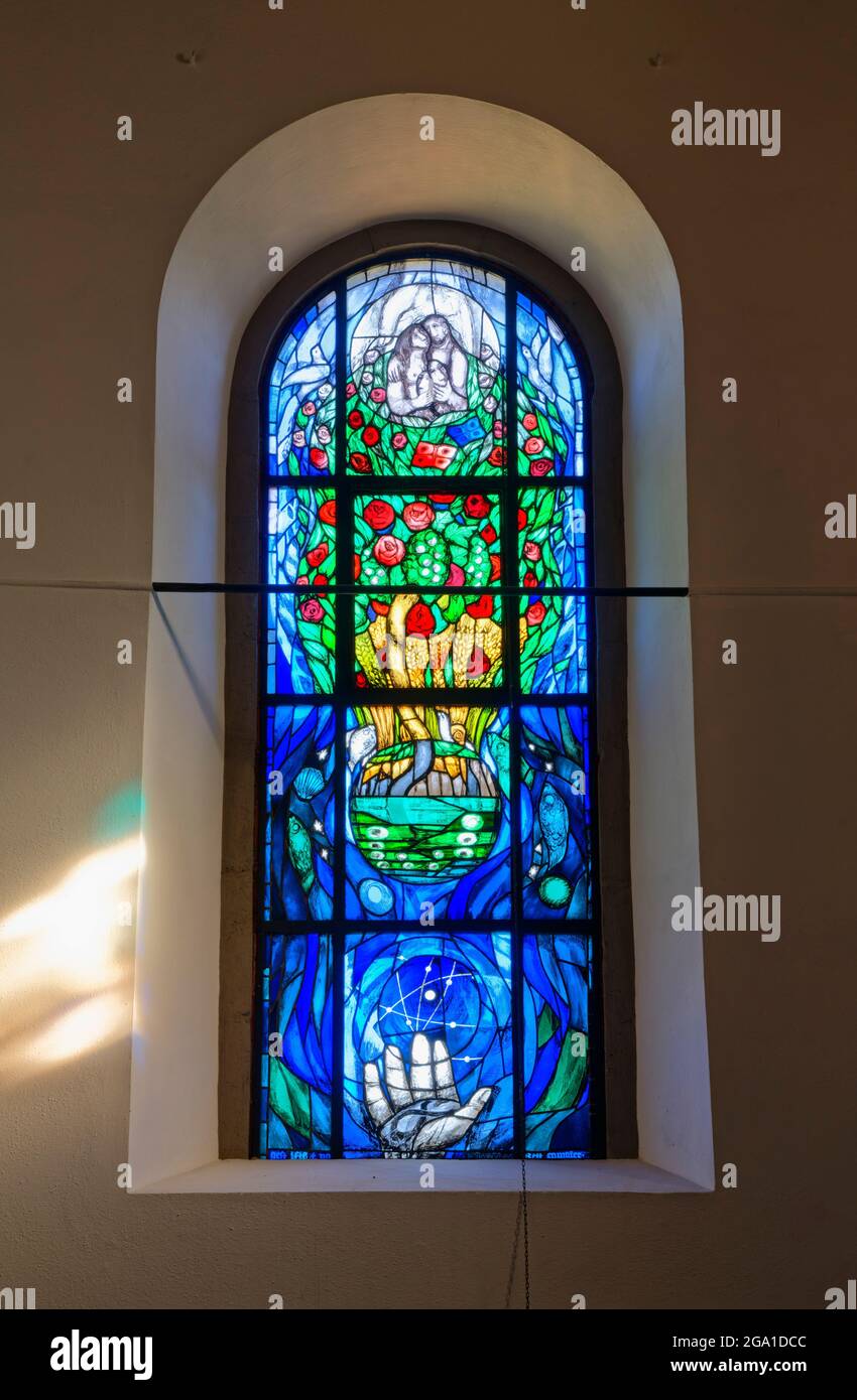 Jakobus church in Hohenberg (part of Rosenberg): church window with  motiv "Creation" (by Sieger Köder), Ostalb District, Baden-Württemberg, Germany Stock Photo
