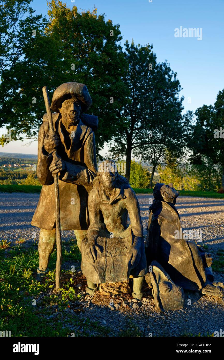 Bronze sulpture "group of pilgrims" (by Sieger Köder) in front of  Jakobus church in Hohenberg (part of Rosenberg), Way of St. James, Baden-Württember Stock Photo