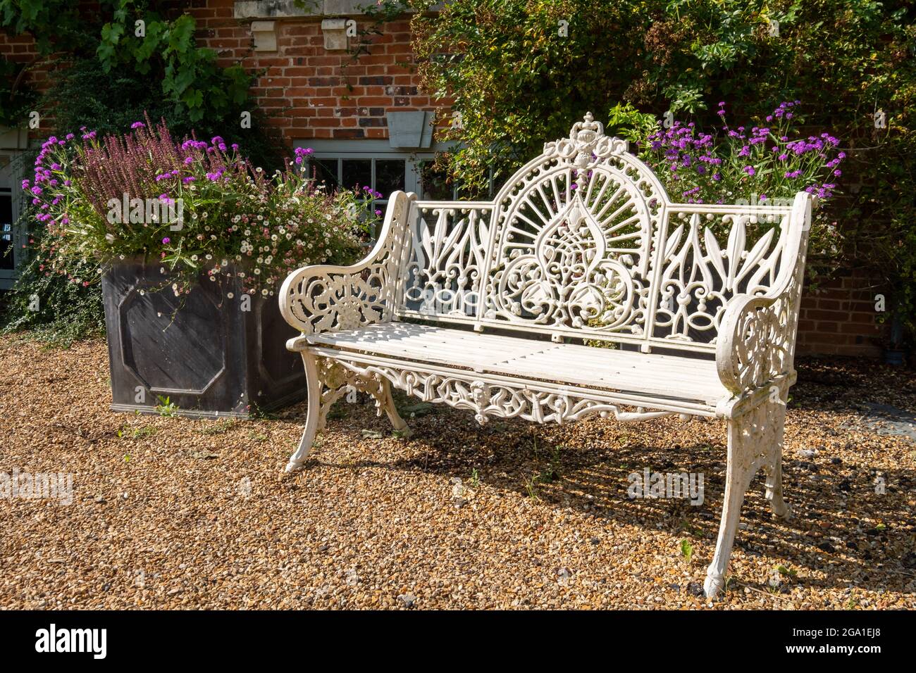 Ornate cast iron metal vintage retro garden seat painted in white