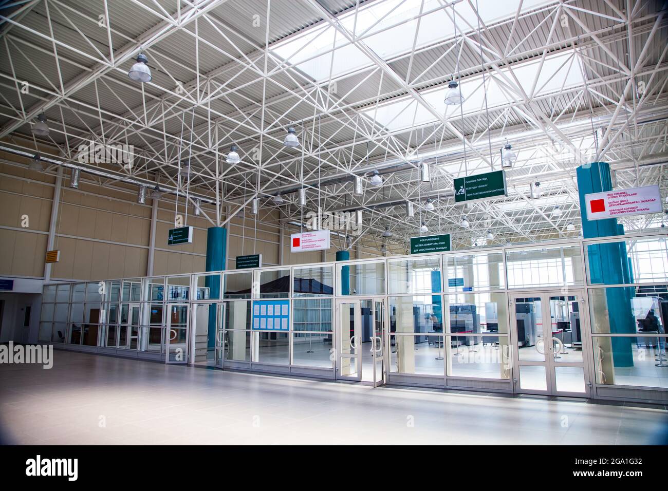 Khorgos, Kazakhstan - June 05, 2012: Interior of empty customs office terminal. Glass walls and doors. Openwork ceiling with windows for lighting. No Stock Photo