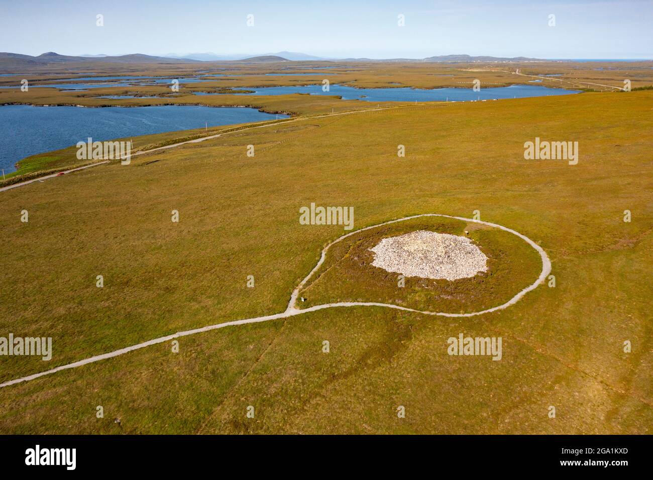 Aerial view from drone of the best preserved Neolithic chambered cairn in the Outer Hebrides at Langass on North Uist, Outer Hebrides, Scotland, UK Stock Photo