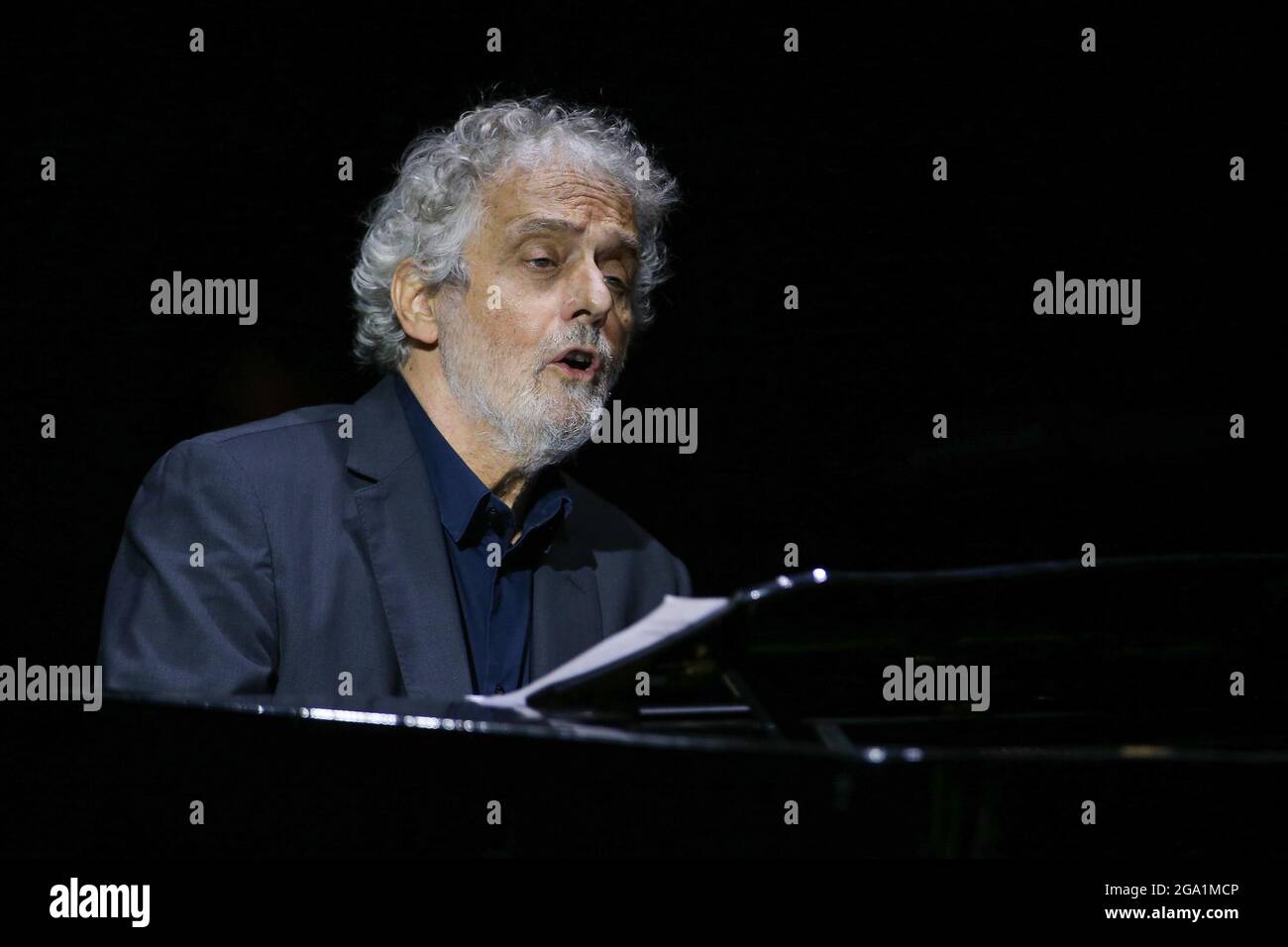 The musician and composer, Nicola Piovani, during the concert at the Trianon Viviani theater in Naples. Stock Photo
