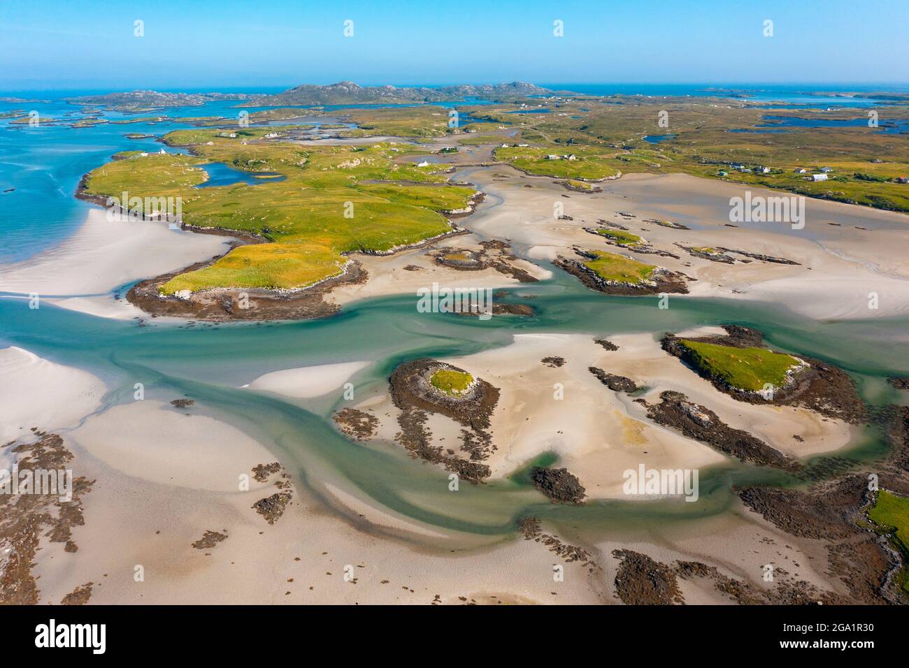 Aerial view from drone of coastal landscape looking towards island of Grimsay on  Benbecula in  the Outer Hebrides, Scotland, UK Stock Photo