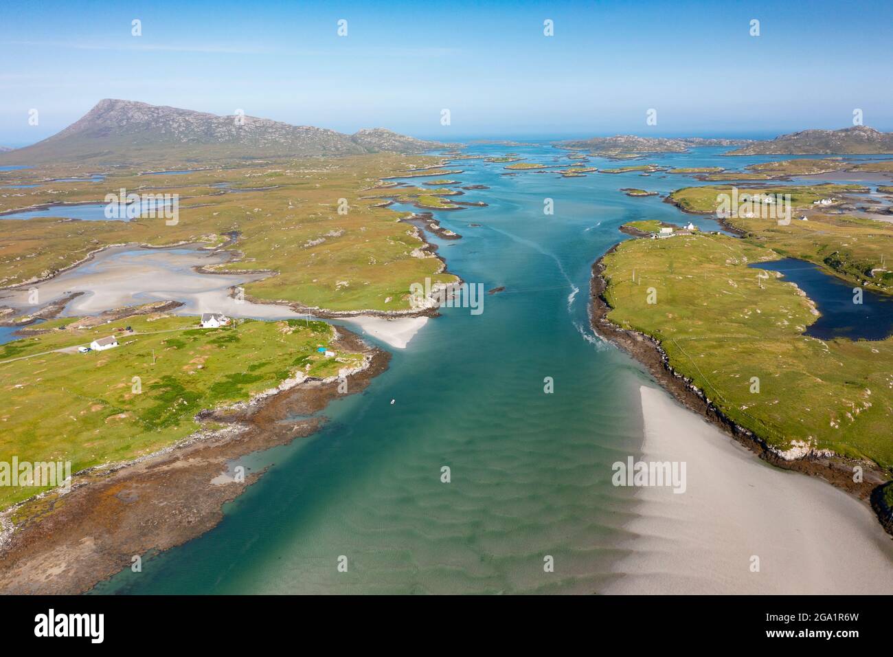 Aerial view from drone of coastal landscape on  Benbecula with Eaval mountain on the left in the Outer Hebrides, Scotland, UK Stock Photo