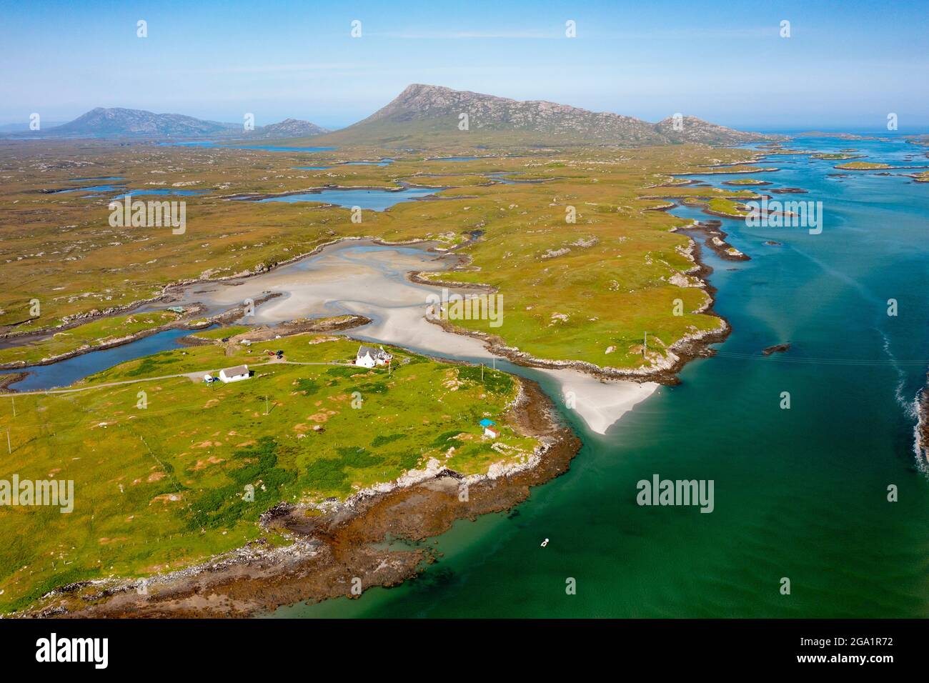 Aerial view from drone of coastal landscape on  Benbecula with Eaval mountain in the distance in the Outer Hebrides, Scotland, UK Stock Photo
