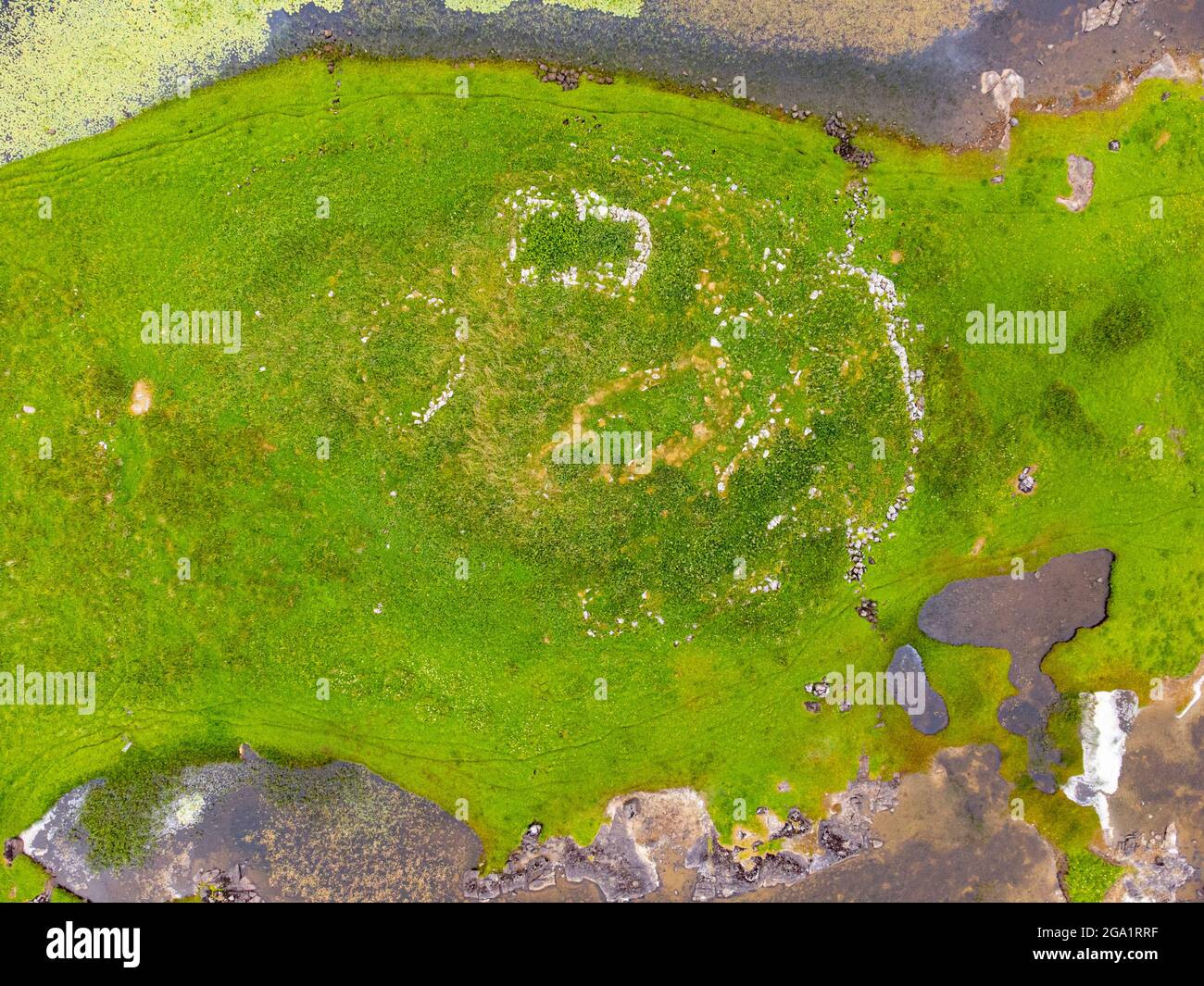 Aerial view from drone of ruin of ancient Norse church near Kildonan on South Uist, Outer Hebrides, Scotland, UK Stock Photo