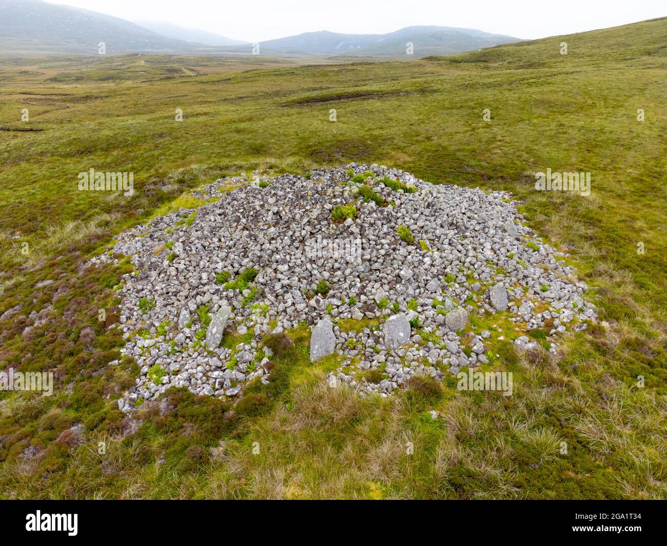 Aerial view from drone of neolithic chambered cairn at Reineval on South Uist, Outer Hebrides, Scotland, UK Stock Photo