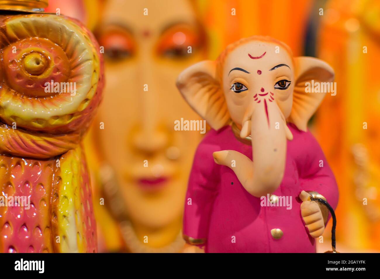 Colorful dolls made of clay, Lord Ganesha, handicrafts on display