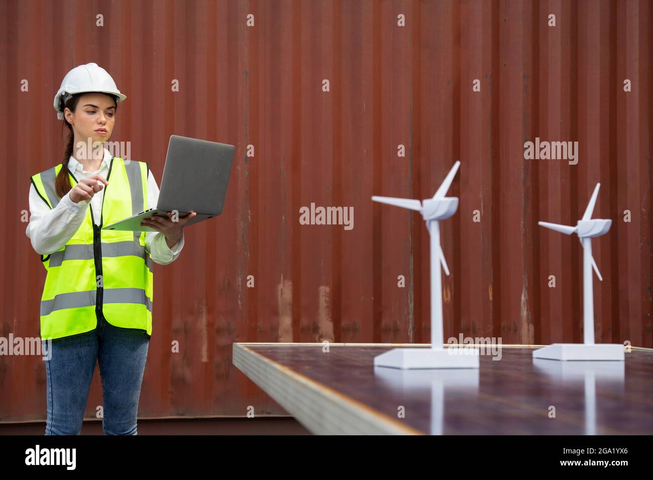 young caucasian woman university student learning and experimental wind and sunlight renewable energy in engineering, bachelor of science, renewable e Stock Photo
