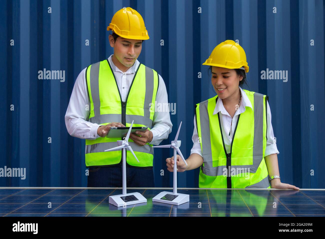young asian man and woman university students learning and experimental wind and sunlight renewable energy in engineering, bachelor of science, renewa Stock Photo
