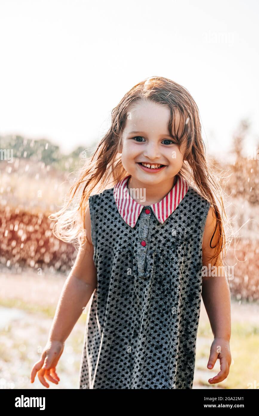 Happy baby girl outdoor summer fun portrait cute hi-res stock ...