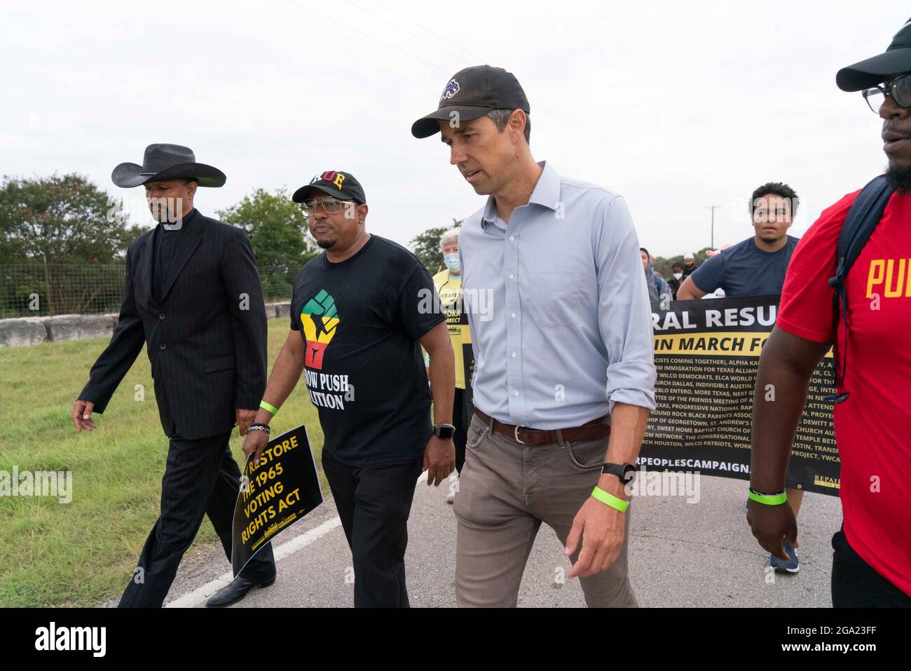 Georgetown, United States. 28th July, 2021. Former congressman and current Democratic activist BETO O'ROURKE (in blue shirt) leads voting rights advocates as they start a 30 mile, four-day march from Georgetown, Texas to the State Capitol in Austin. Due to summer Texas heat, several 100-person shifts will trade off marching about 4 miles each. Credit: Bob Daemmrich/Alamy Live News Stock Photo