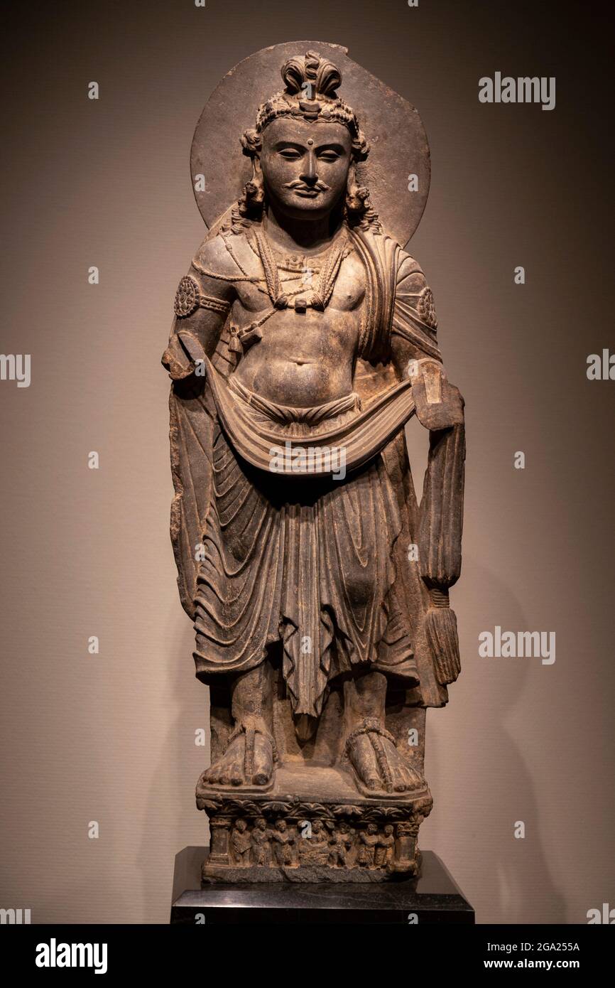 ancient standing Bodhisattva Buddha schist statue image in 2nd century, Kushan dynasty from Gandhara, Pakistan. Stock Photo