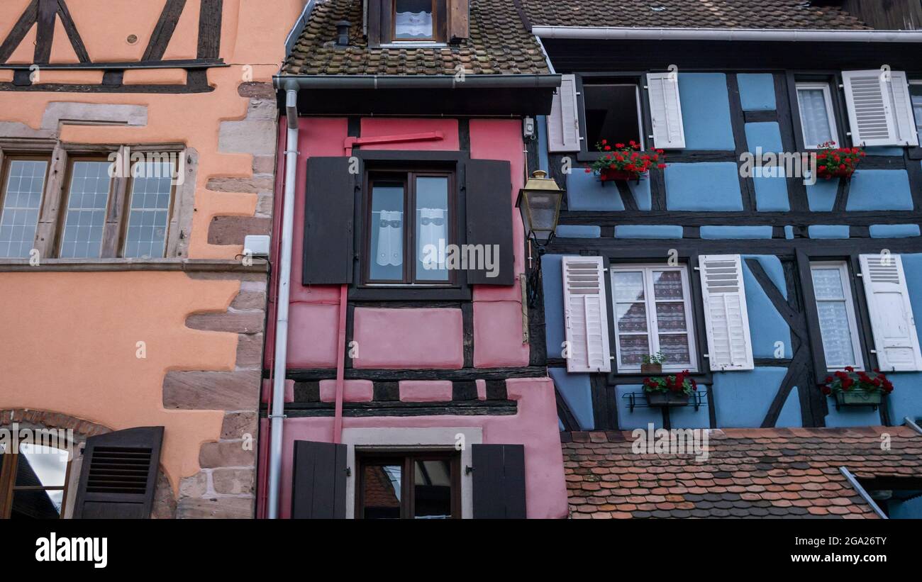 Tightly situated antique houses facades in a Alsace village. Old half-timbering wall construction. Stock Photo