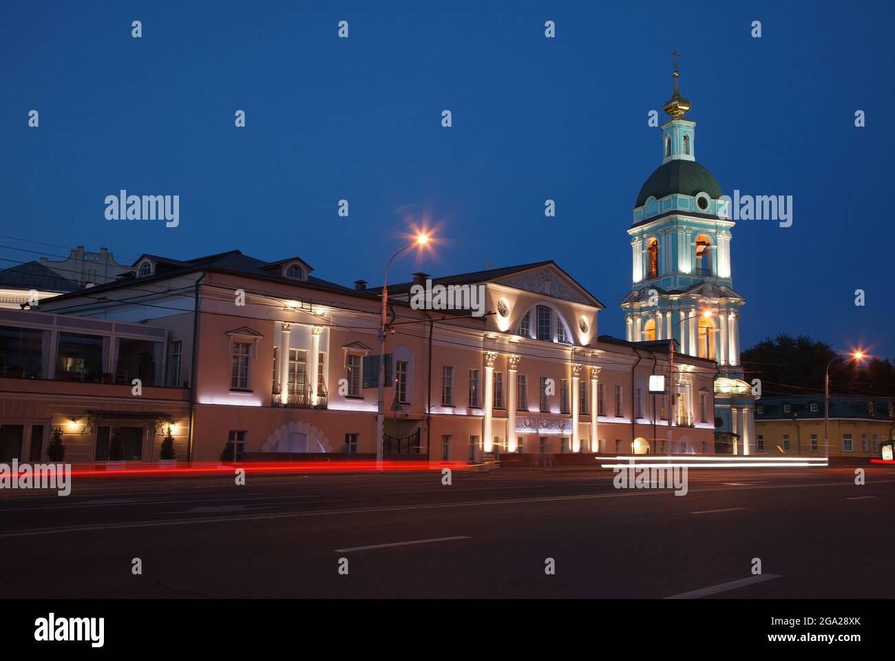 Moscow, Russia - July, 27 2014: Historical center at night. Mansion (left) and church bell tower (right) Stock Photo