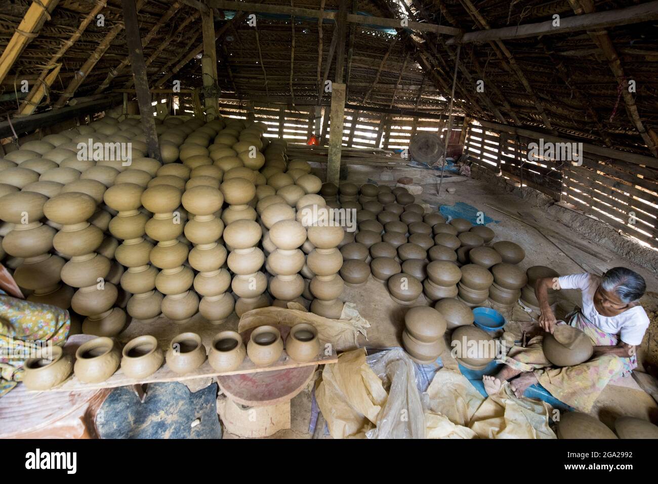 Woman making clay pots in rural village of Sri Lanka; Gampaha District