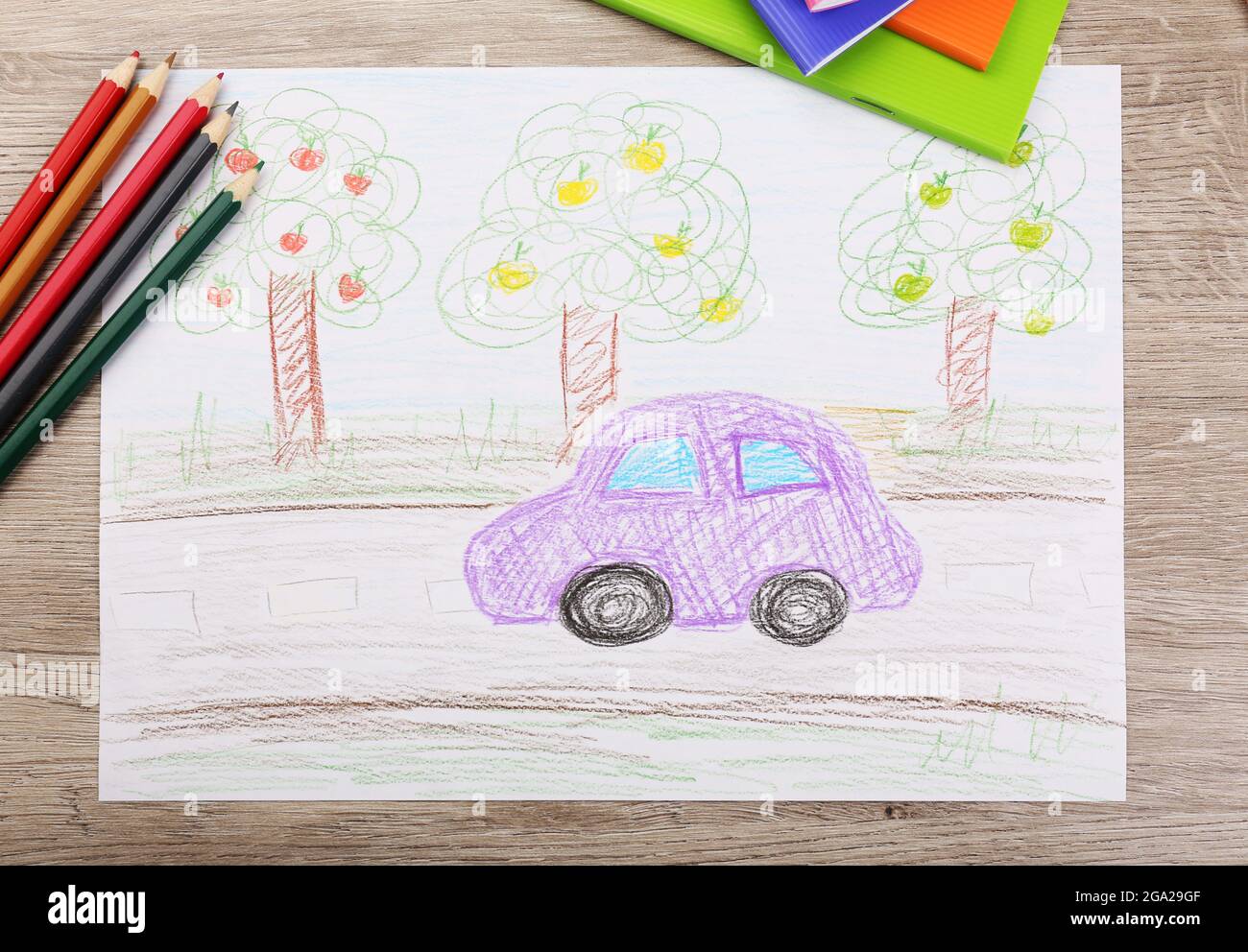 Kids drawing on white sheet of paper with crayons, closeup Stock Photo -  Alamy