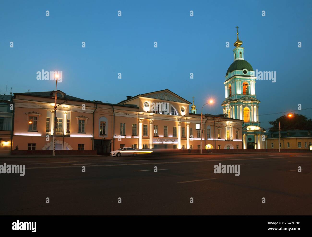 Moscow, Russia - July, 27 2014: Historical center at night. Mansion (left) and church bell tower (right) Stock Photo