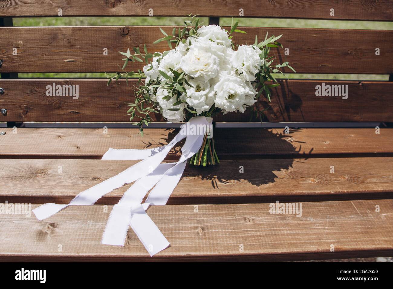 White bridal bouquet of peonies and roses. Scenery for the wedding ...