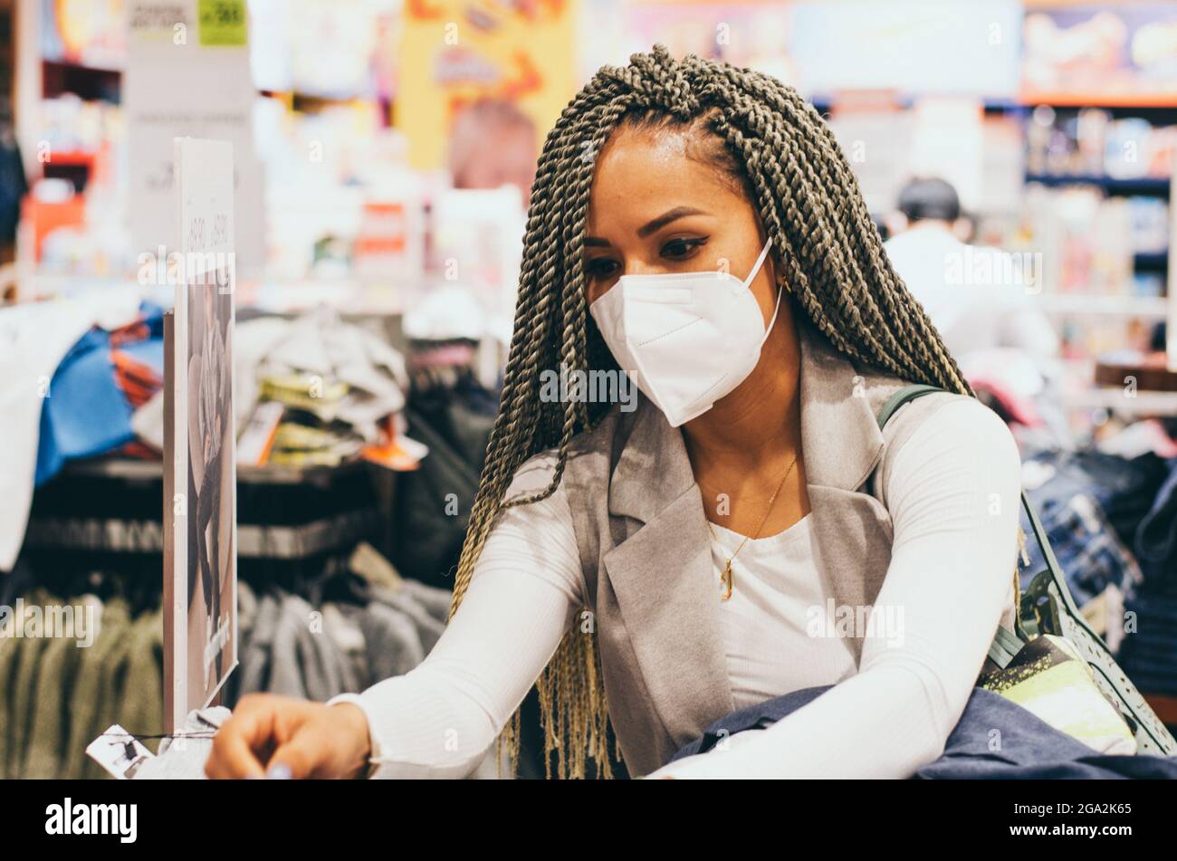 Beautiful woman with braids and protective mask on her face antivirus ...