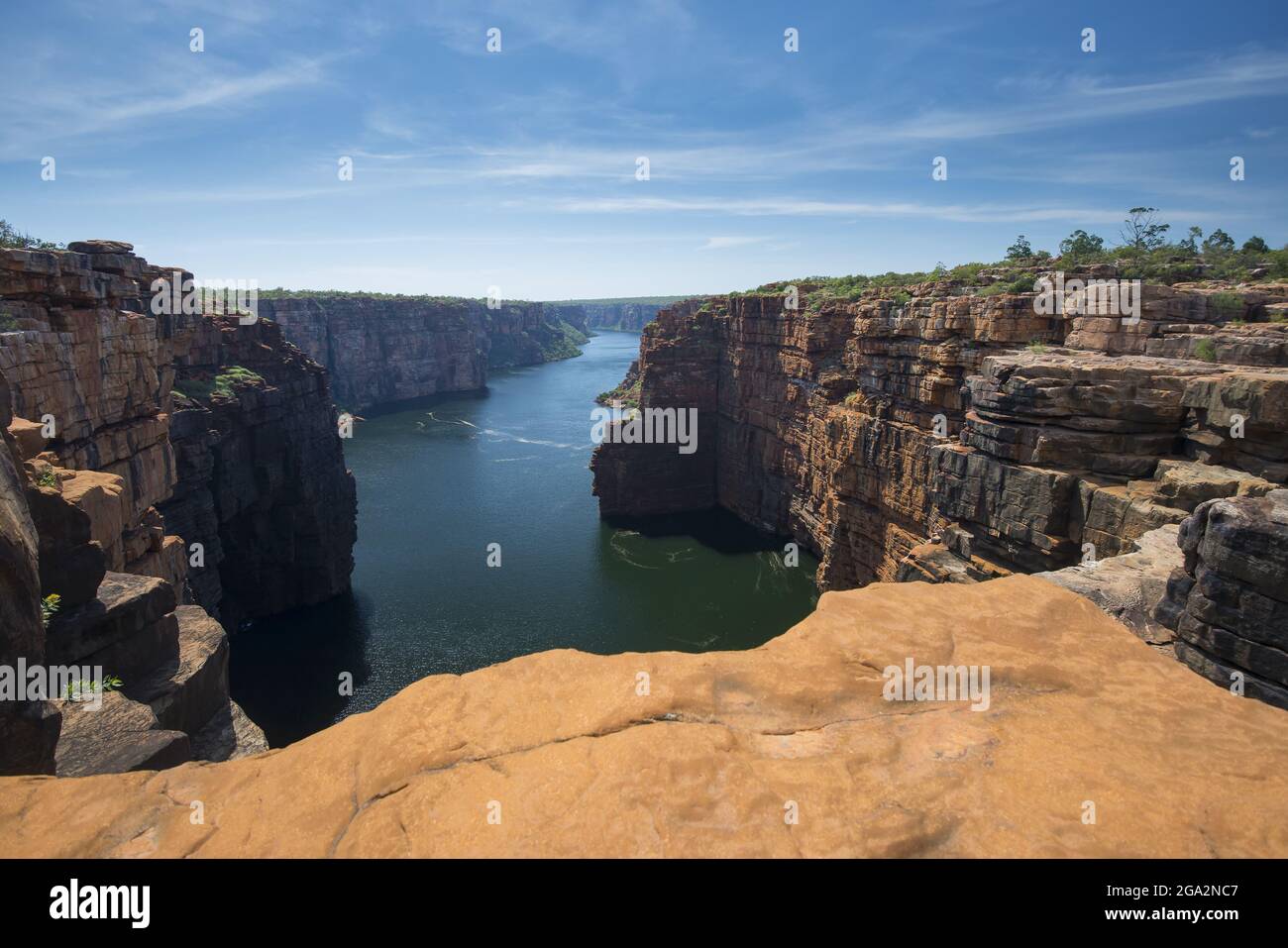 Springtime at the lookout at the King George River waterfall in the Kimberley Region, looking through the sandstone cliffs overlooking the river below Stock Photo