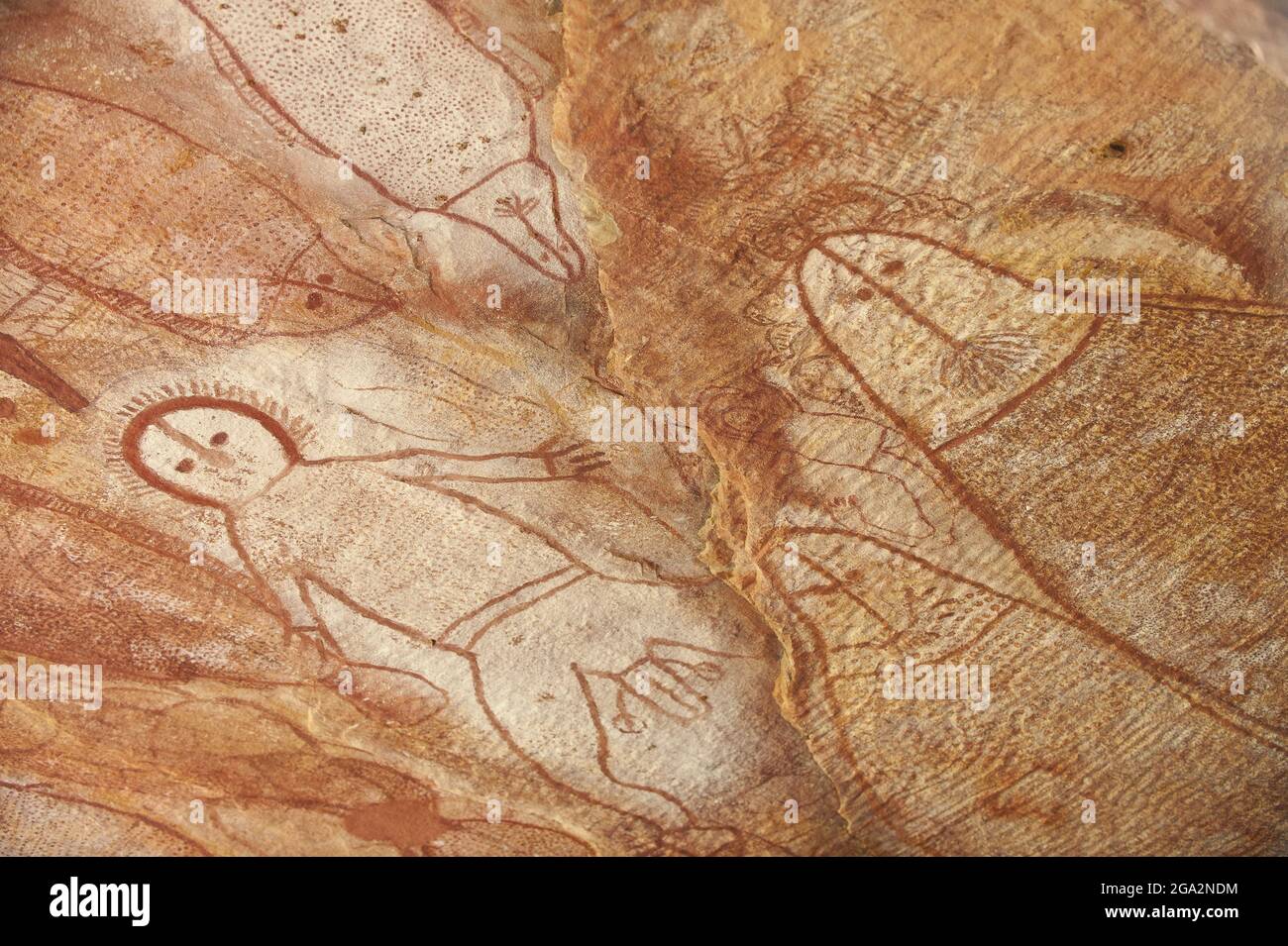 Close-up of Wandjina Aboriginal rock paintings on the sandstone walls in a cave at Raft Point; Western Australia, Australia Stock Photo