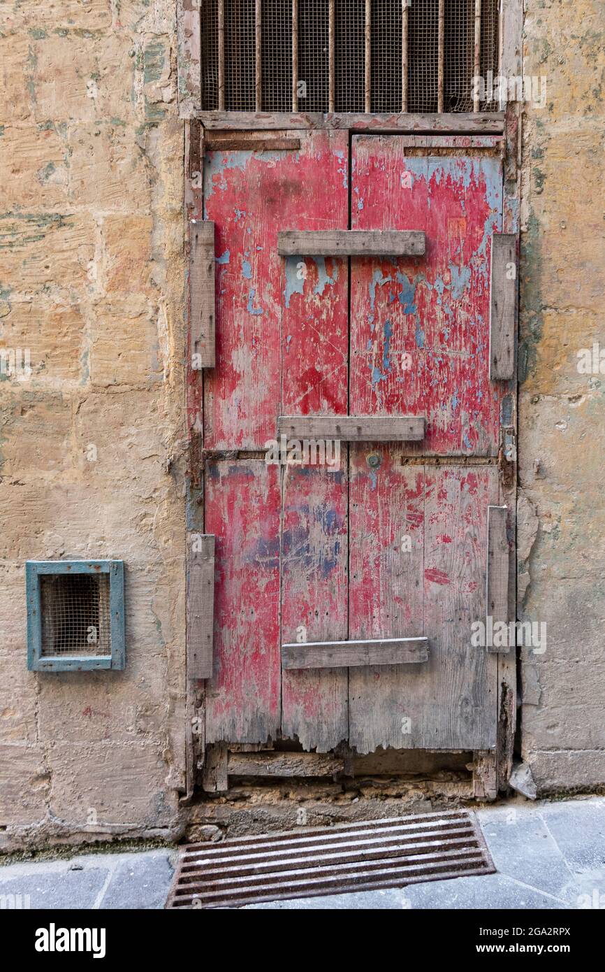 Blocked off doorway entrance on an old sandstone block building in Malta. Stock Photo