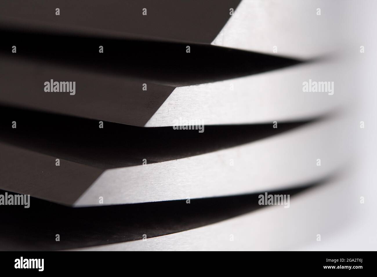 Stainless steel object. Parallel grooves, curves and lines on a ...