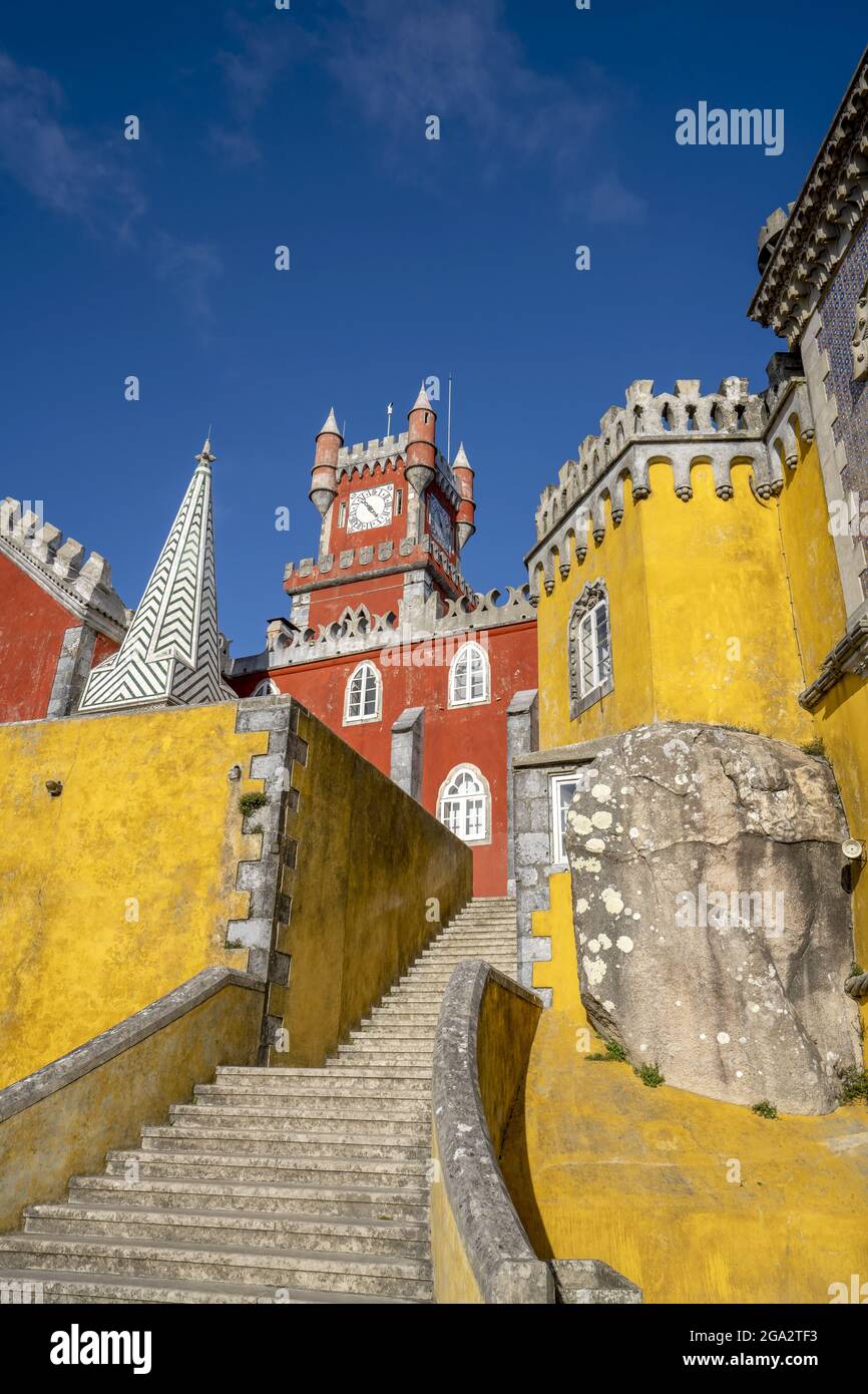 The hilltop castle of Palacio Da Pena with its colorful towers and stone staircase situated in the Sintra Mountains; Sintra, Lisbon District, Portugal Stock Photo
