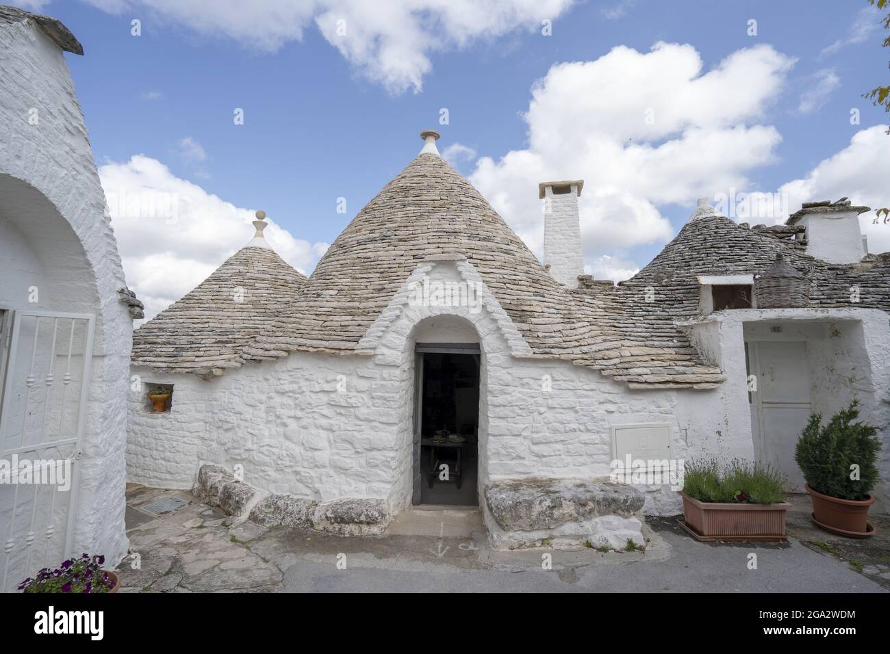 Traditional Apulian round stone Trulli houses of Alberobello; Alberobello, Puglia, Italy Stock Photo