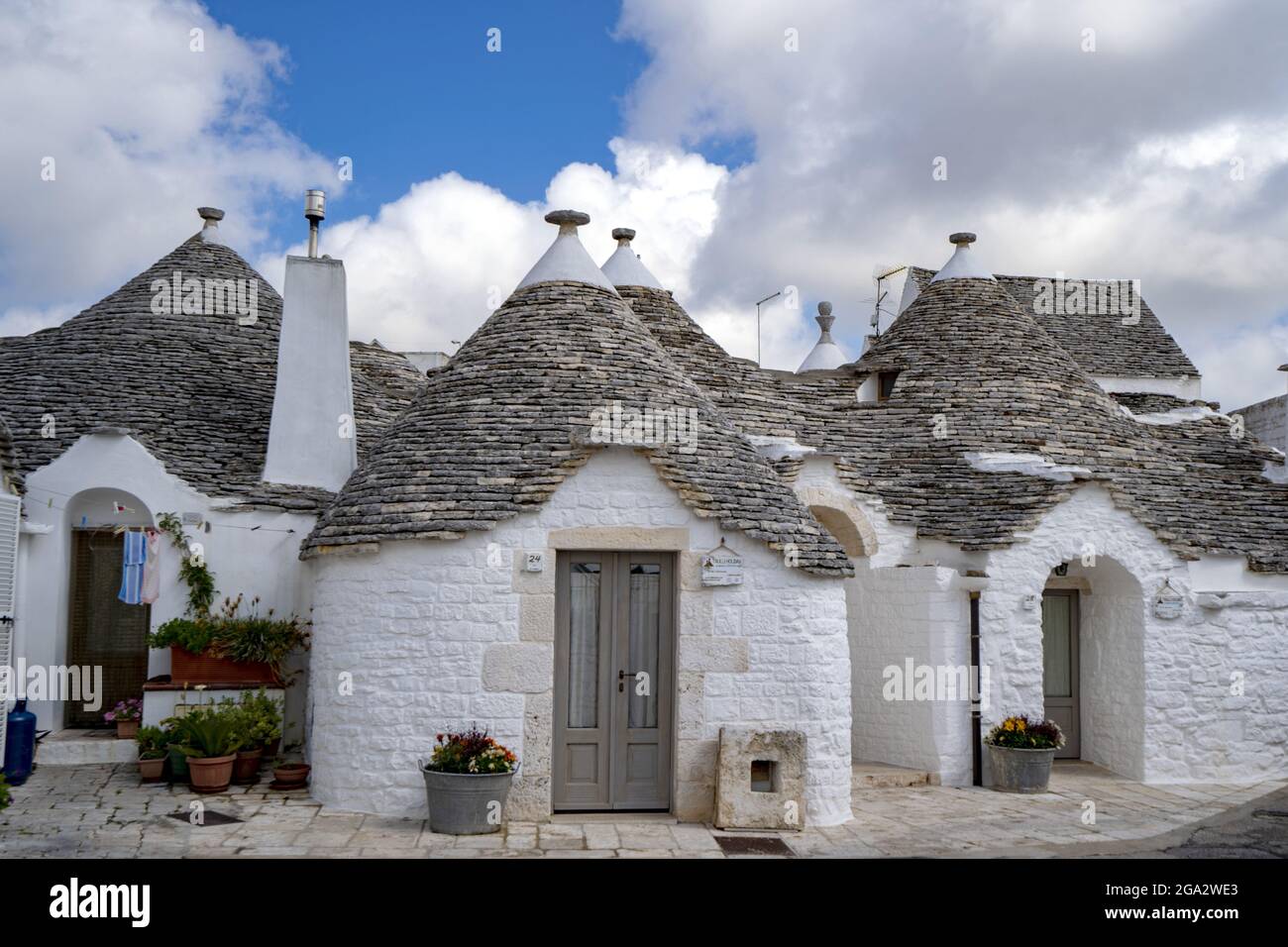 Traditional Apulian round stone Trulli houses of Alberobello; Alberobello, Puglia, Italy Stock Photo