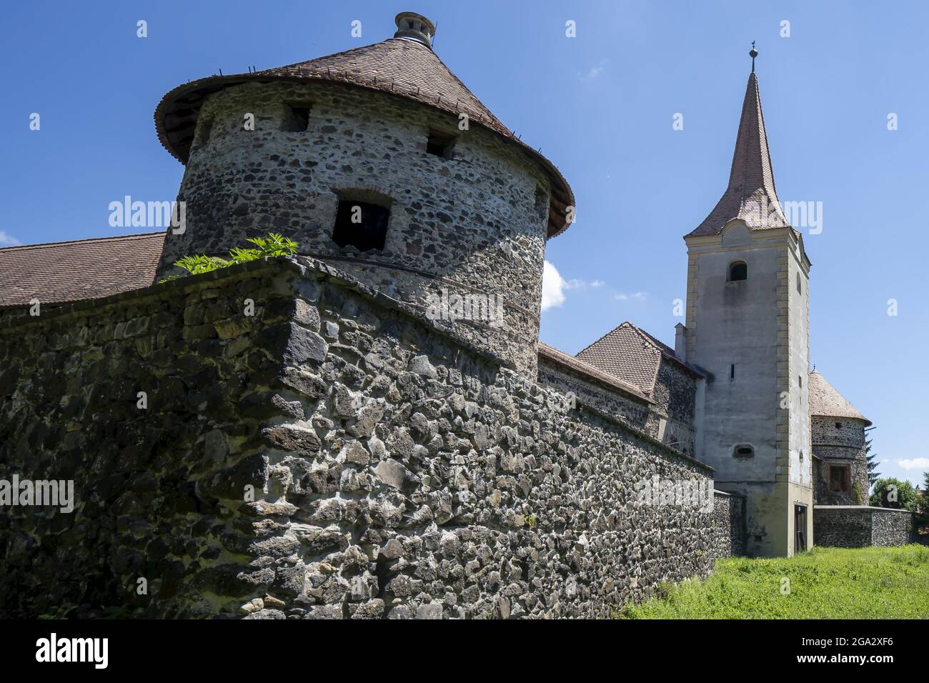 Close-up of the round tower of the square tower with spire at the Cetatea Bethlen Medieval Castle in Racos; Racos, Transylvania, Romania Stock Photo