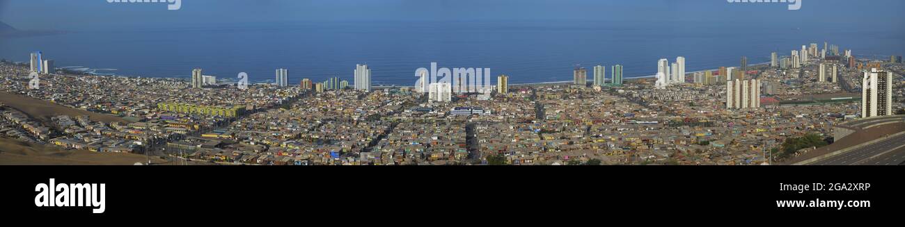 Stitch pan of entire town of Iquique against ocean from a high angle view;  Iquique, Tarapaca, Chile Stock Photo