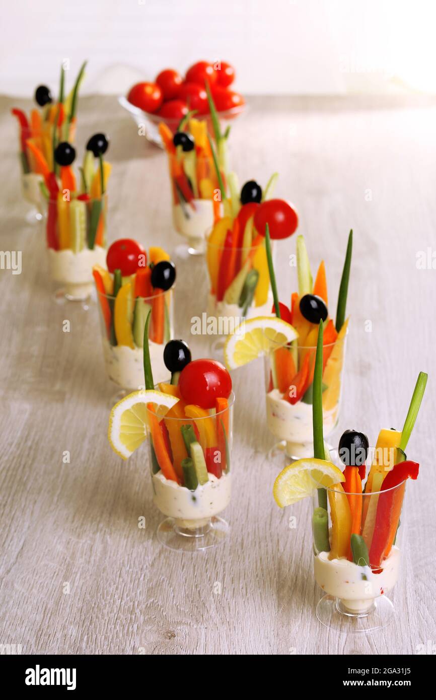 Snack of vegetables in glassware on wooden background Stock Photo Alamy