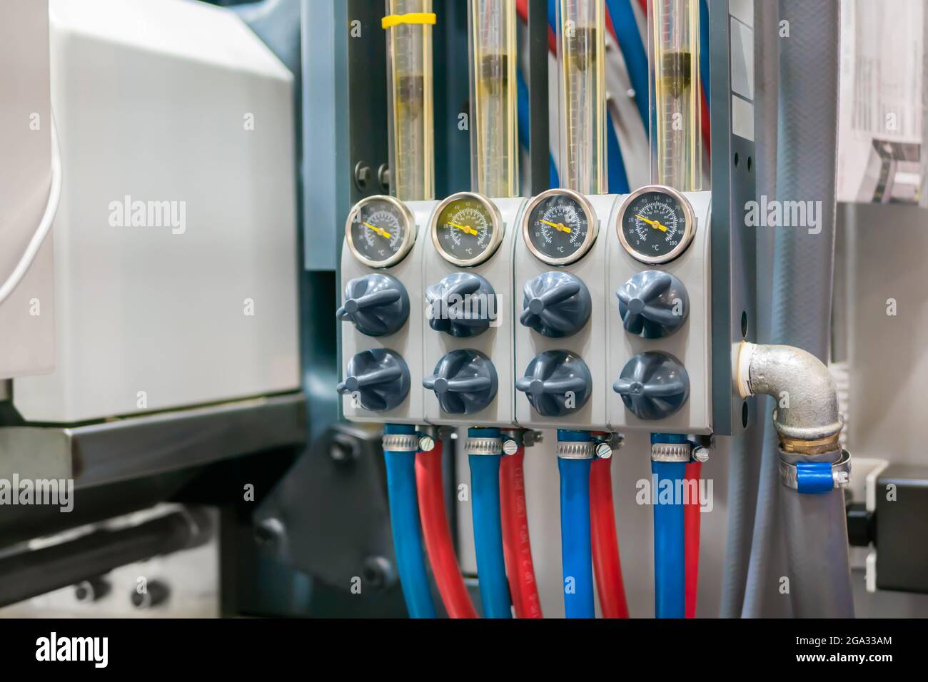 Flowmeter, rotameter - flow regulator for cooling system of injection machine Stock Photo