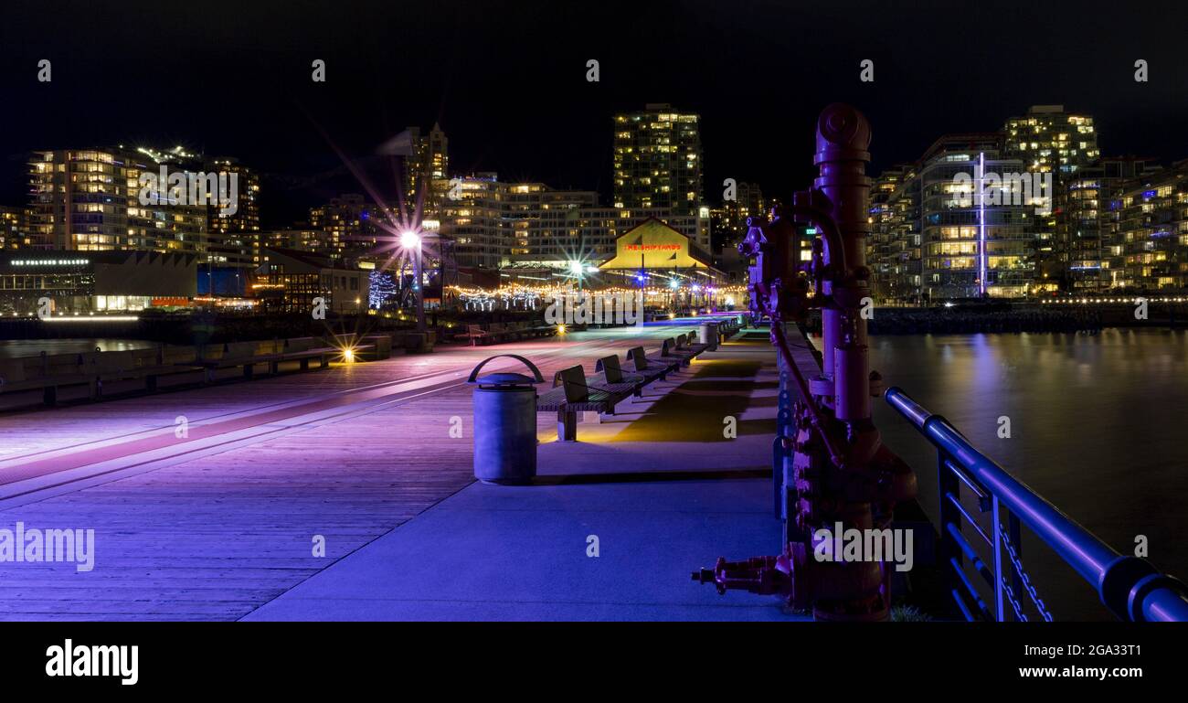 Lonsdale Quay illuminated with colourful lights at night; North Vancouver, British Columbia, Canada Stock Photo