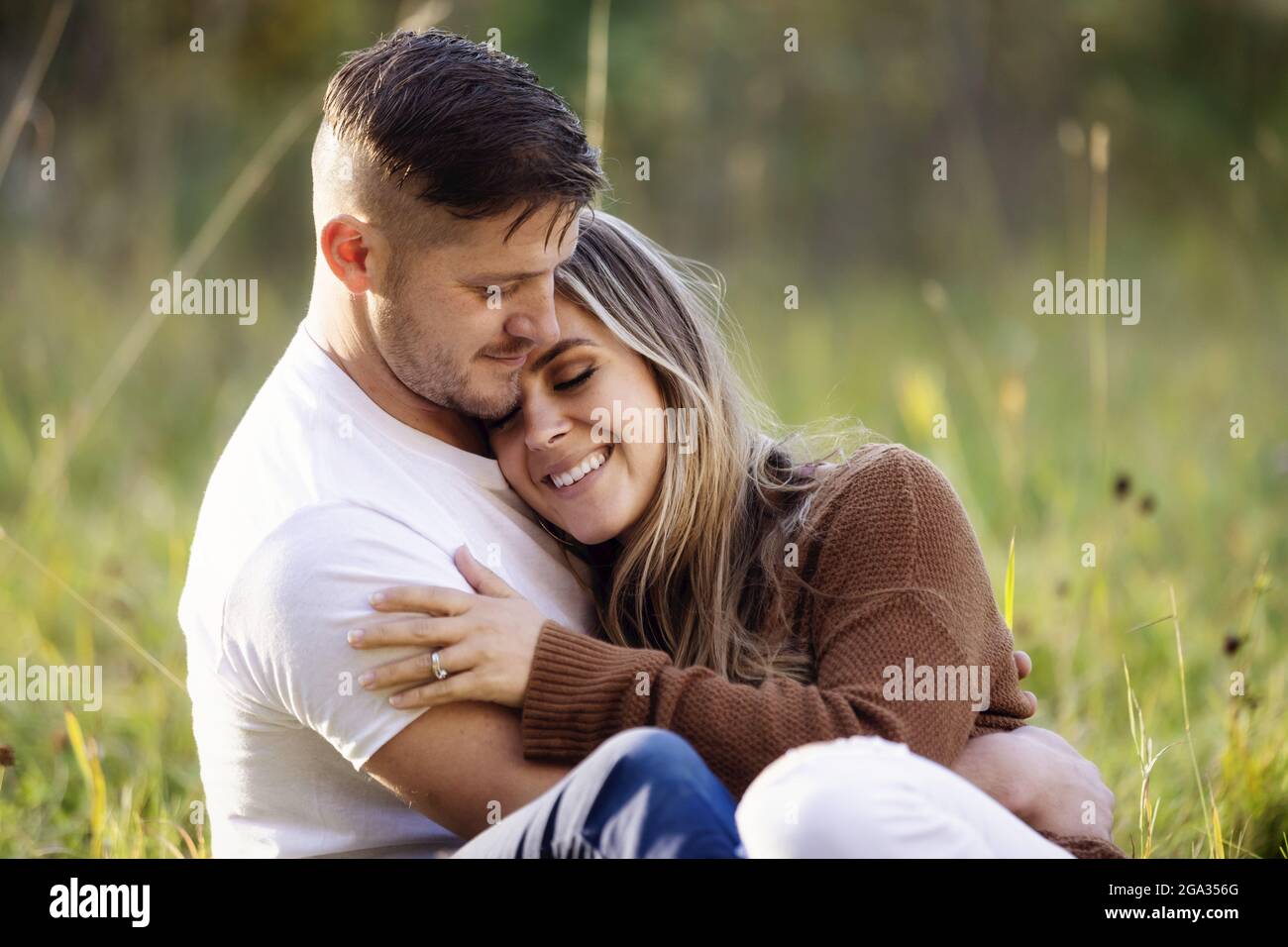 A husband and wife spending quality time together outoors in a city park; Edmonton, Alberta, Canada Stock Photo