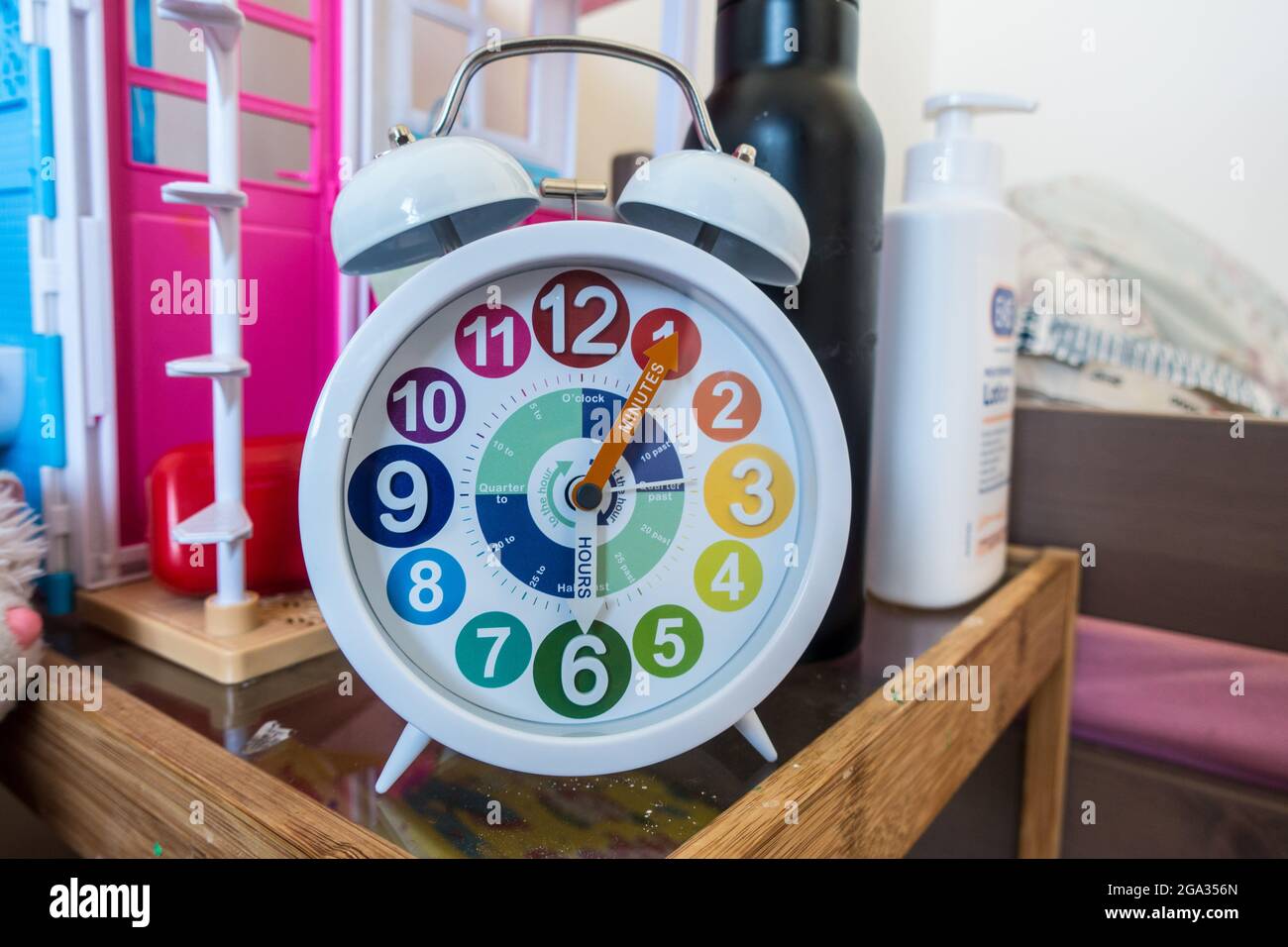 Childrens alarm clock with writing and color coded Stock Photo Alamy