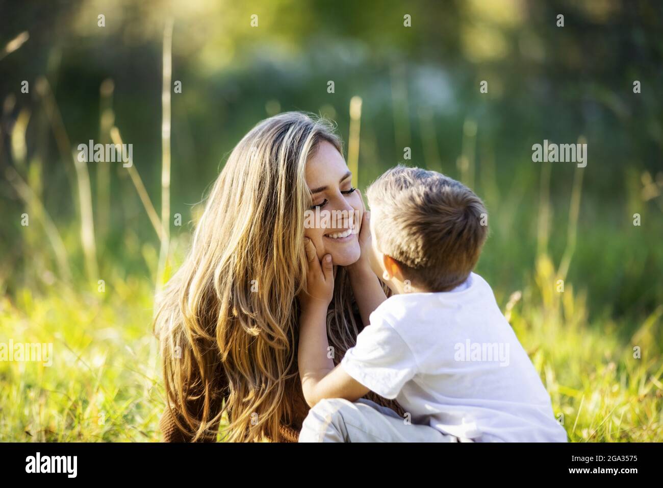 A mother spending quality time with her young son, outdoors in a city park; Edmonton, Alberta, Canada Stock Photo