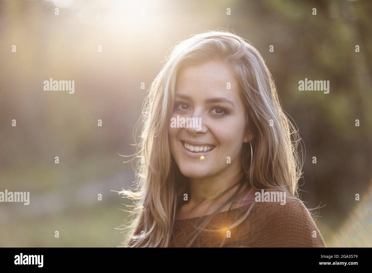 Portrait of a beautiful young woman in a city park; Edmonton, Alberta, Canada Stock Photo