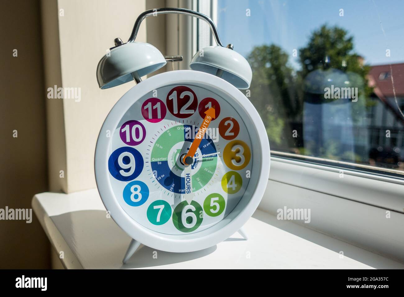 Childrens alarm clock with writing and color coded Stock Photo
