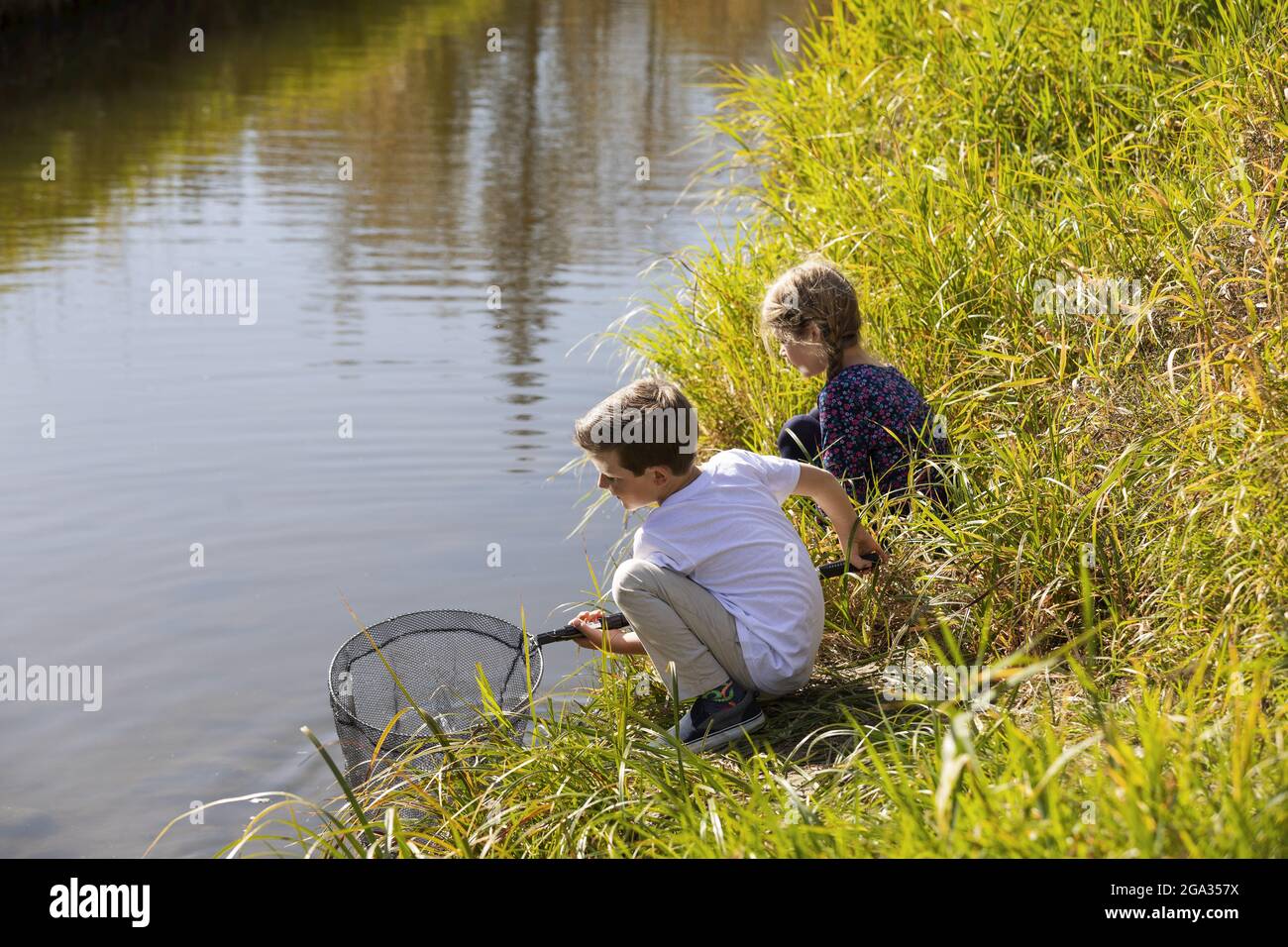 Fishing kids water pole hi-res stock photography and images - Page 2 - Alamy