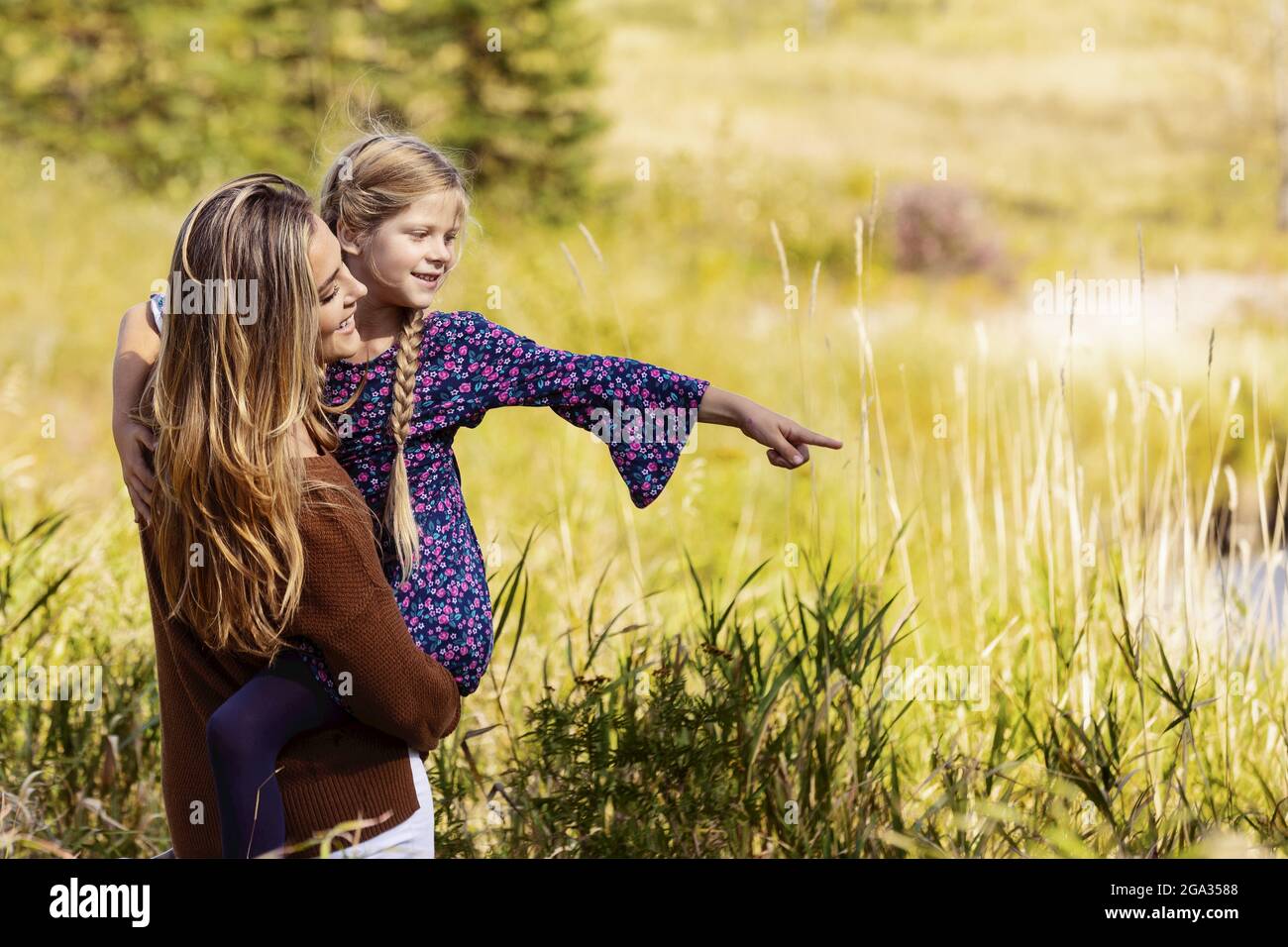A mother spending quality time outdoors with her daughter in a city park; Edmonton, Alberta, Canada Stock Photo