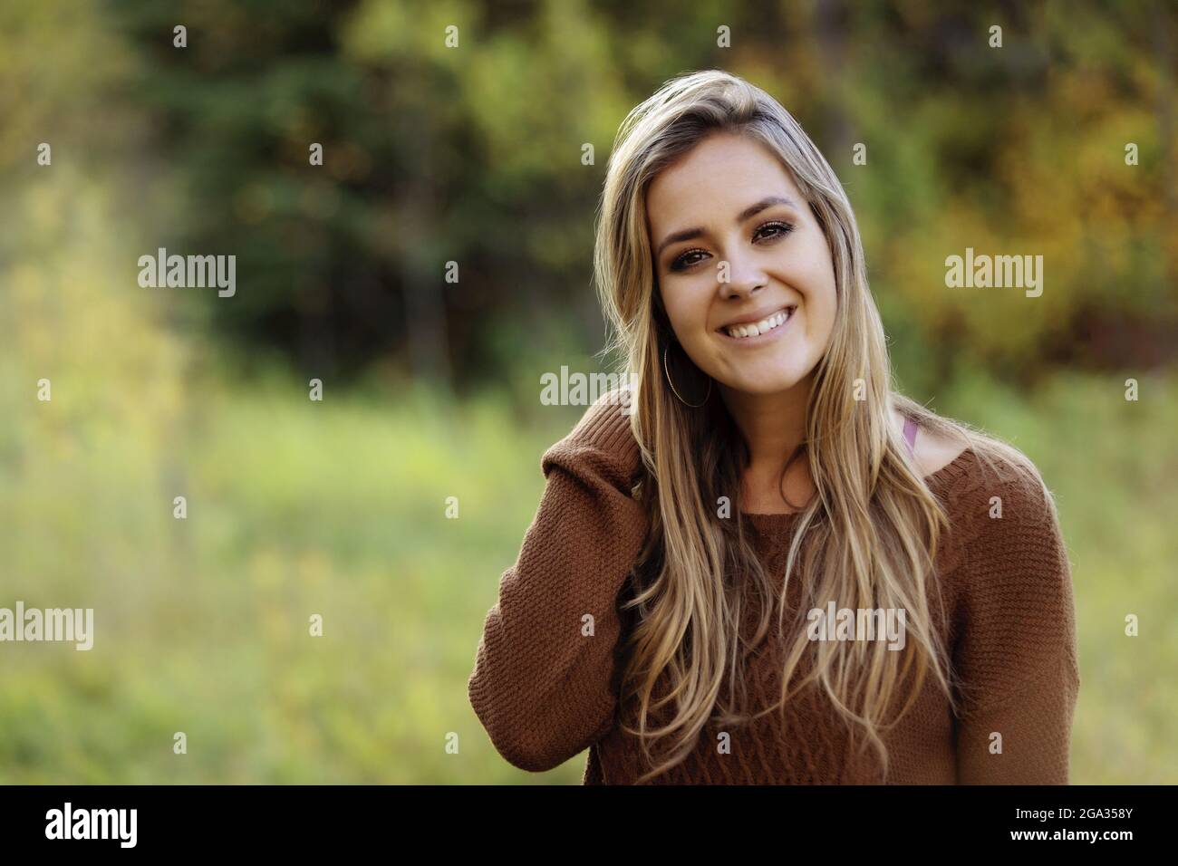 Portrait of a beautiful young woman in a city park; Edmonton, Alberta, Canada Stock Photo