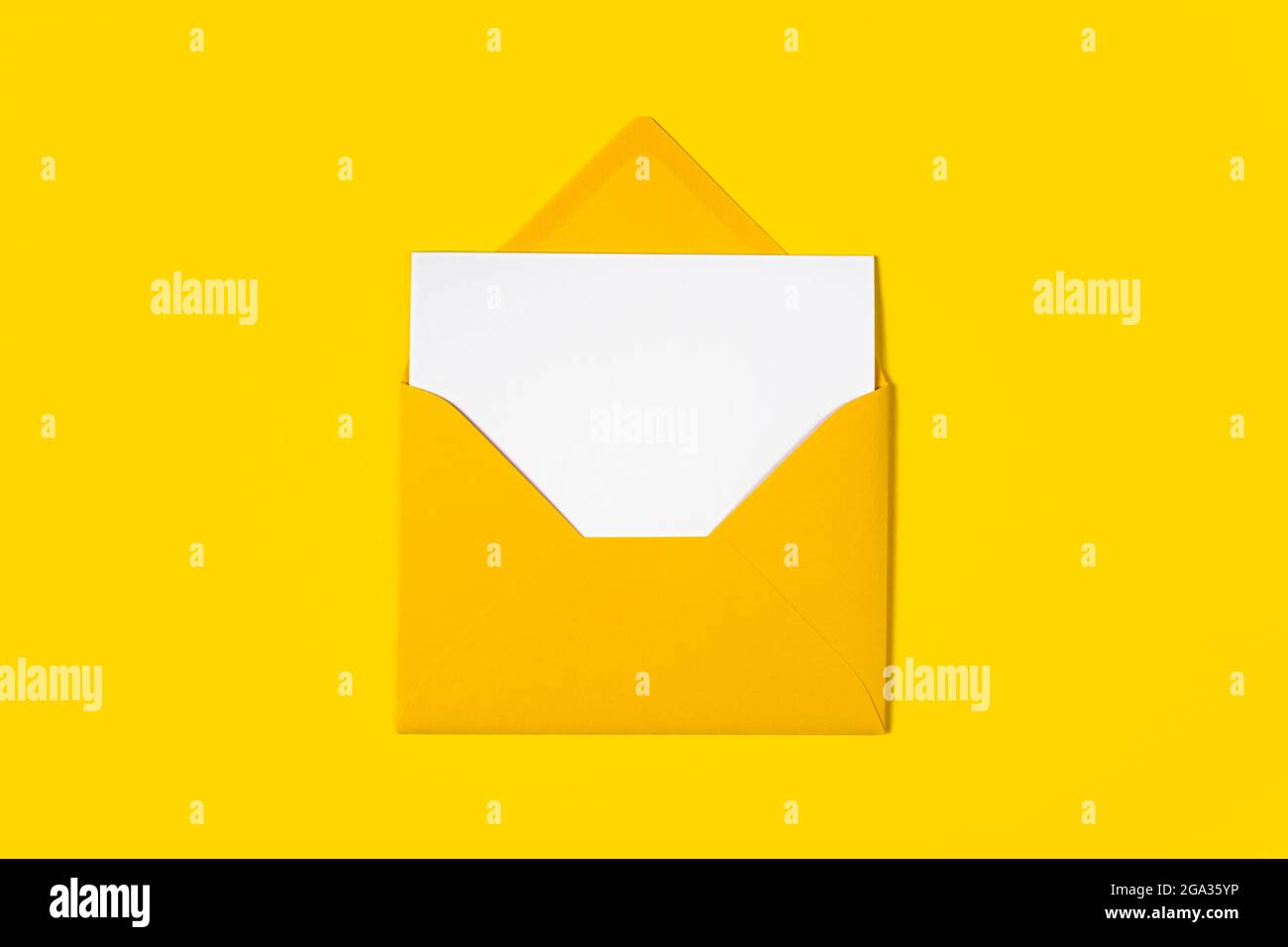 Blank white card with yellow envelope isolated on yellow background ...