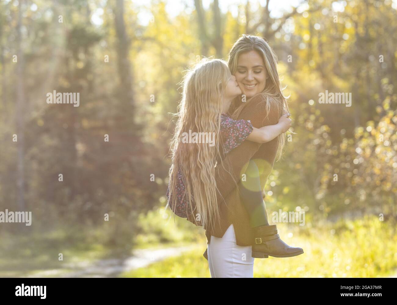 A mother spending quality time with her young daughter, outdoors in a city park; Edmonton, Alberta, Canada Stock Photo