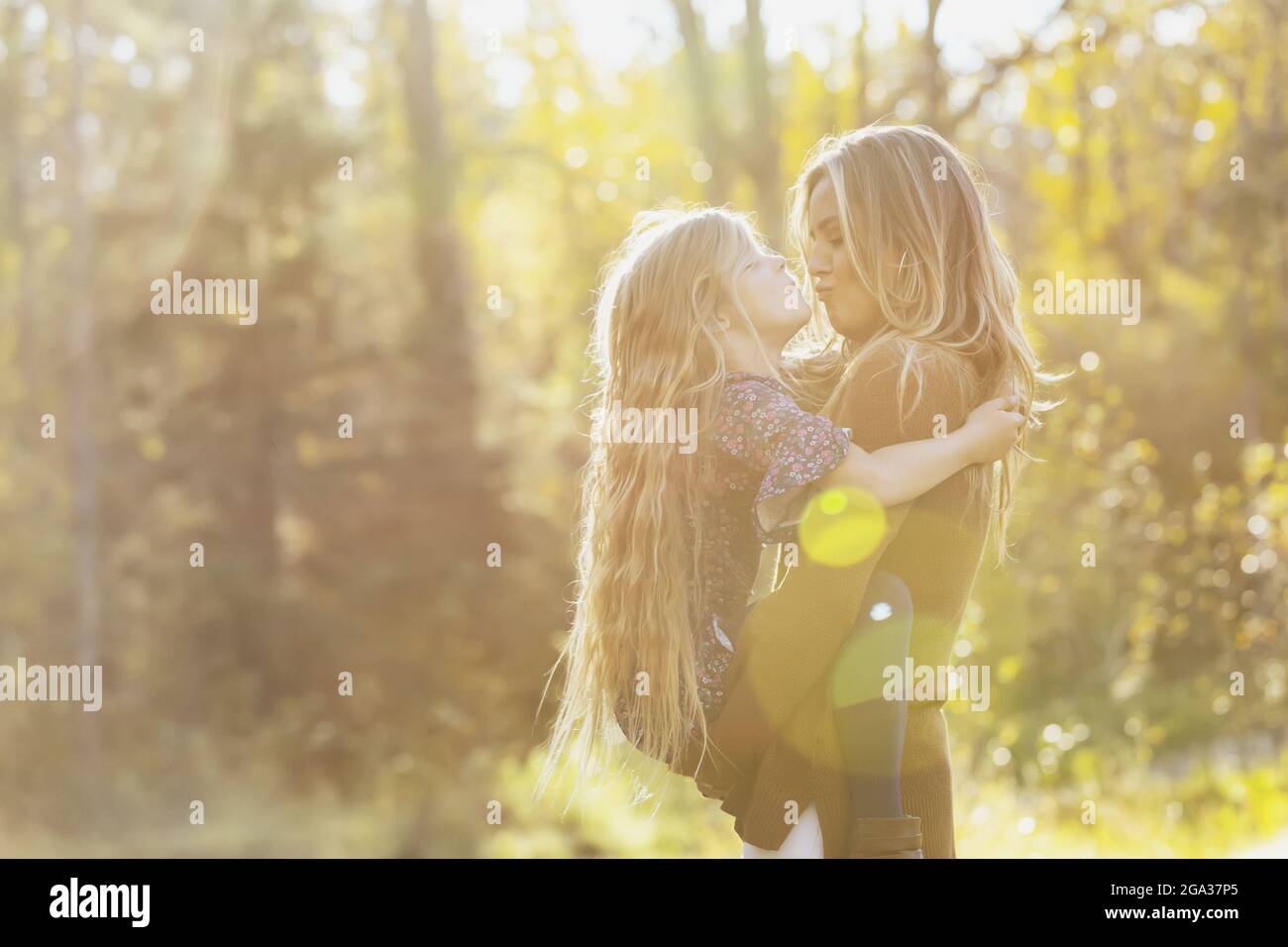 A mother spending quality time with her young daughter, outdoors in a city park; Edmonton, Alberta, Canada Stock Photo