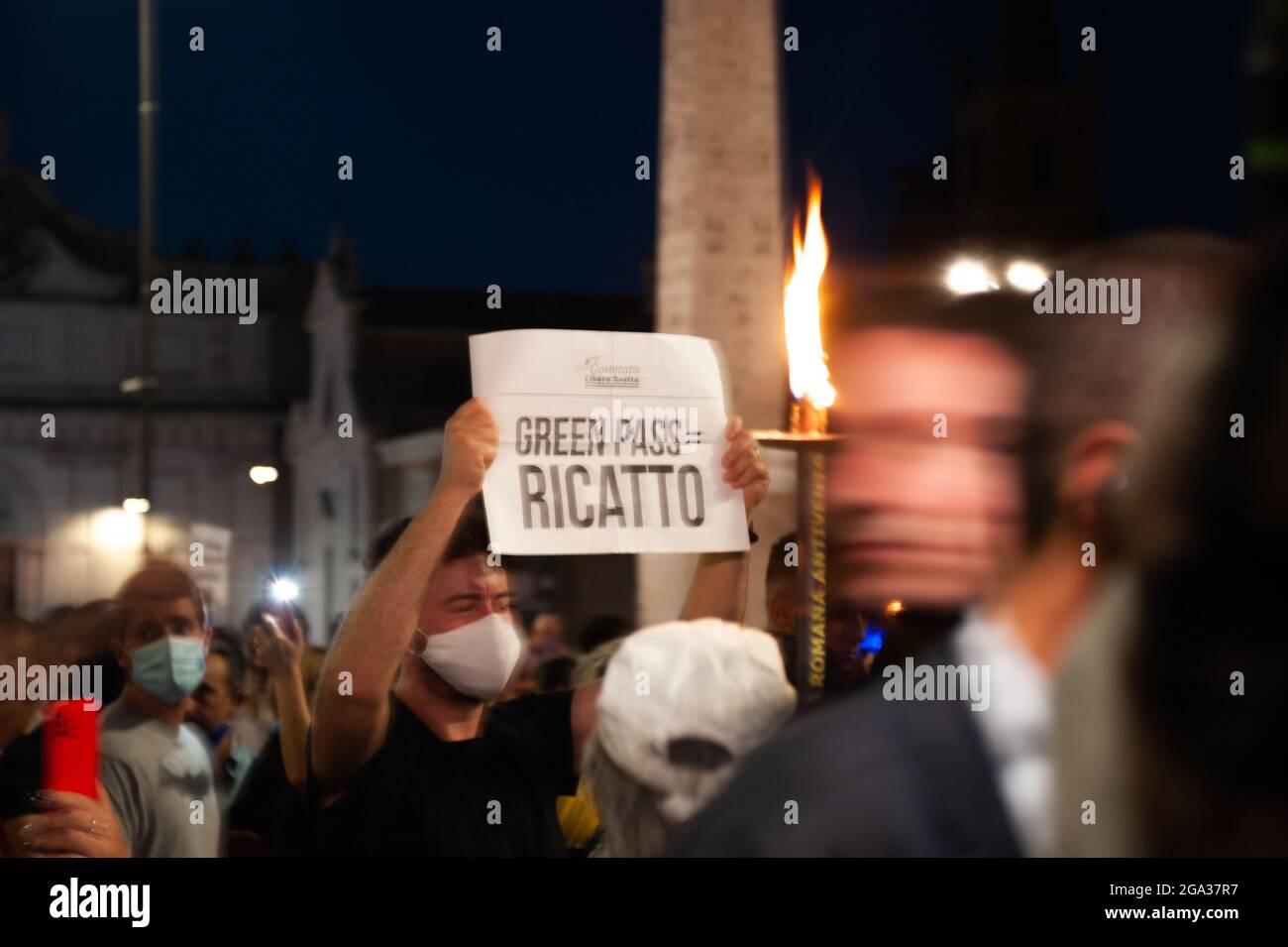 Rome 28 July 2021, Italian no vax in a torchlight procession against the decisions of Prime Minister Draghi to apply the Green pass Stock Photo